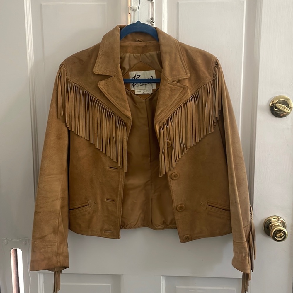 Vintage genuine leather western style jacket with fringe. Fits like a small.